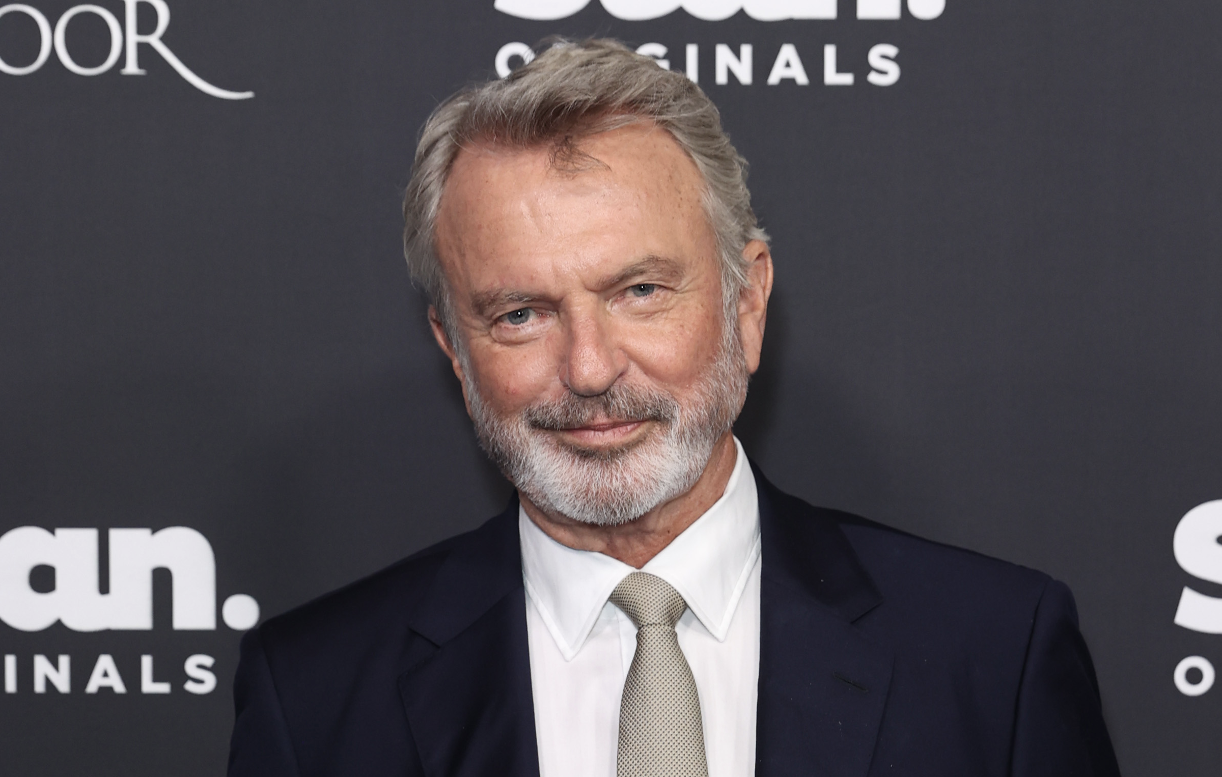 Source-feed image associated with Sam Neill, ‘Jurassic Park’ Star, Dies at 78
