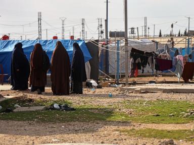 Source-feed image associated with Australian woman and daughter to return from Syrian camp for IS families