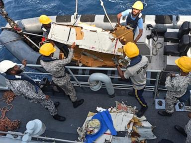 Source-feed image associated with Pakistani rescuers battle rough seas on 2nd day of search for cargo plane crew