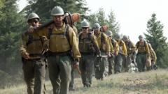Source-feed image associated with Team of former prison inmates on frontline of Spokane wildfires