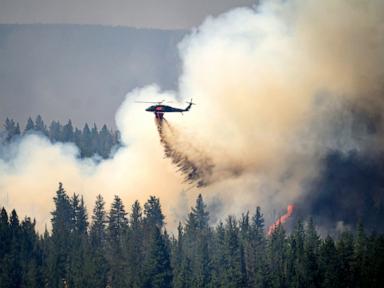 Source-feed image associated with Oregon firefighters brace for windy and hot weather as they battle dozens of blazes