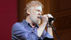Source-feed image associated with Bono, Eddie Vedder and Hozier among mourners at Glen Hansard's funeral