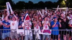 Source-feed image associated with New Yorkers celebrate a thrilling possibility: The Knicks could soon be champions