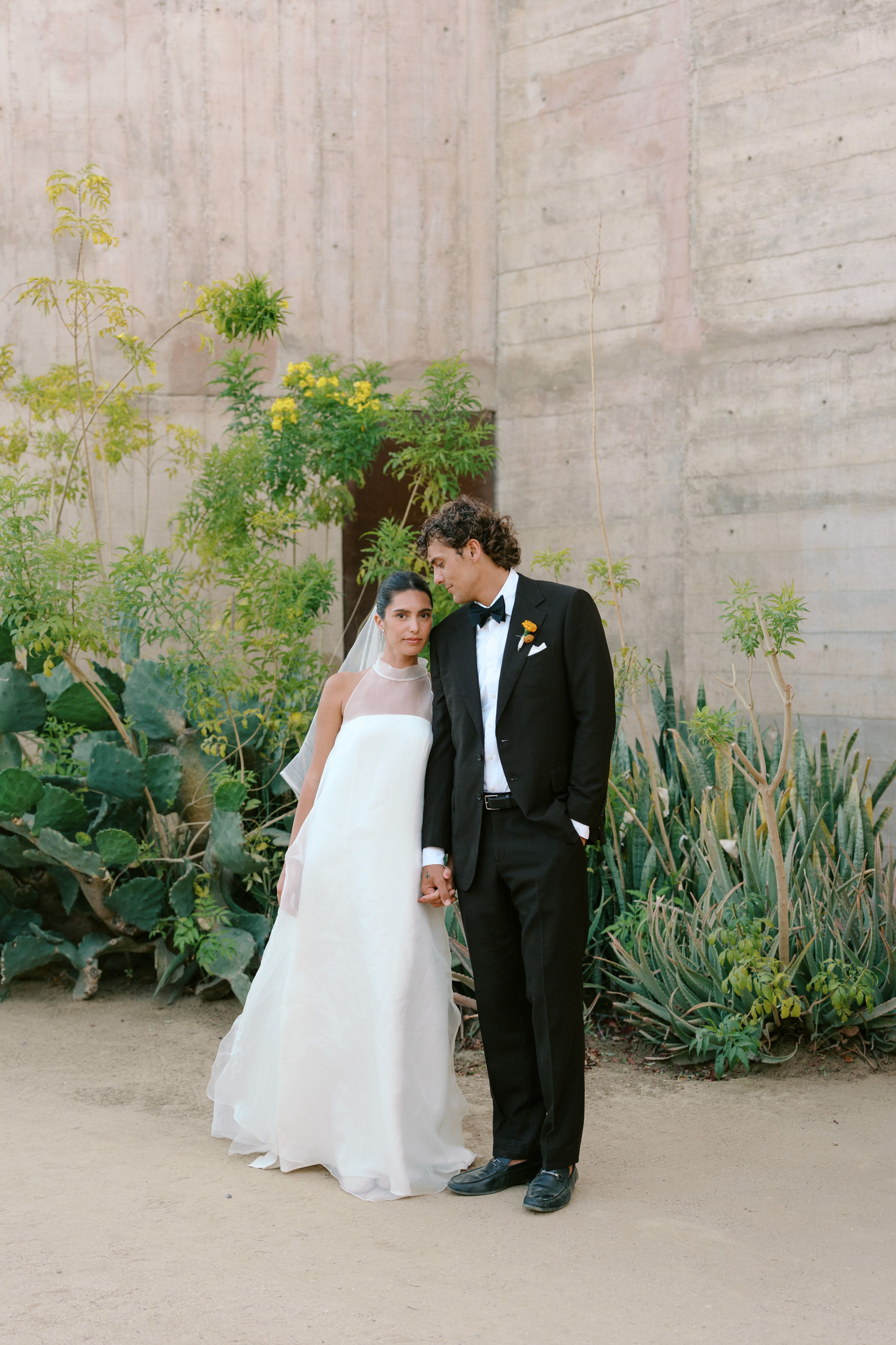 Source-feed image associated with At This Baja California Wedding, There Were Colorful Outfits, Desert Flowers, and Mezcal Old Fashioneds