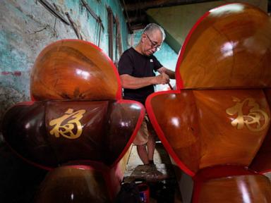 Source-feed image associated with A traditional Chinese coffin maker in Malaysia preserves a fading family craft