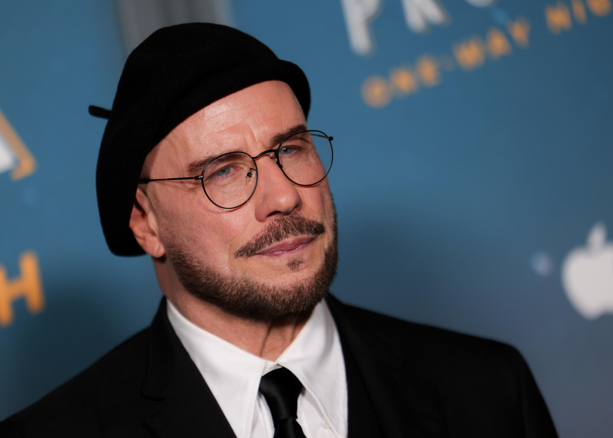 Source-feed image associated with John Travolta Now Owns a Dozen Berets Because ‘Men Can Have Fun, Too. Why Not Change it Up?’