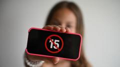 Source-feed image associated with France passes law banning under-15s from social media