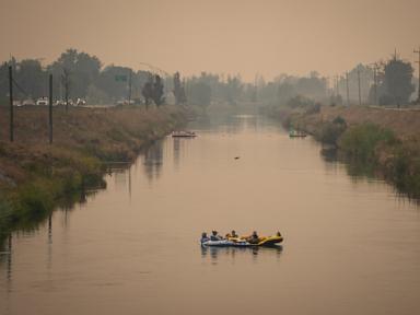 Source-feed image associated with Mexican reinforcements arrive for wildfire fight in western Canada after 20,000 flee