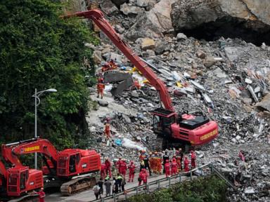 Source-feed image associated with Rescuers race to find survivors in the rain after a landslide in China kills at least 8
