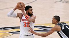 Source-feed image associated with Knicks lead NBA Finals after late run beats Spurs