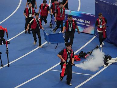 Source-feed image associated with A robot sprinter shatters a 100-meter record again as sparks fly at China’s robot competition