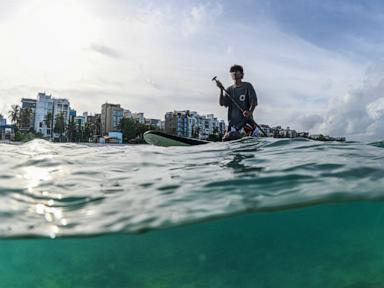 Source-feed image associated with Young activists in the Maldives confront climate threats to their island nation