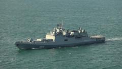 Source-feed image associated with UK investigating reports Russian warship fired warning shots near yacht in English Channel