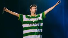 Source-feed image associated with Semi-pro football club 'in shock' after shirt worn by Reading Festival headliners