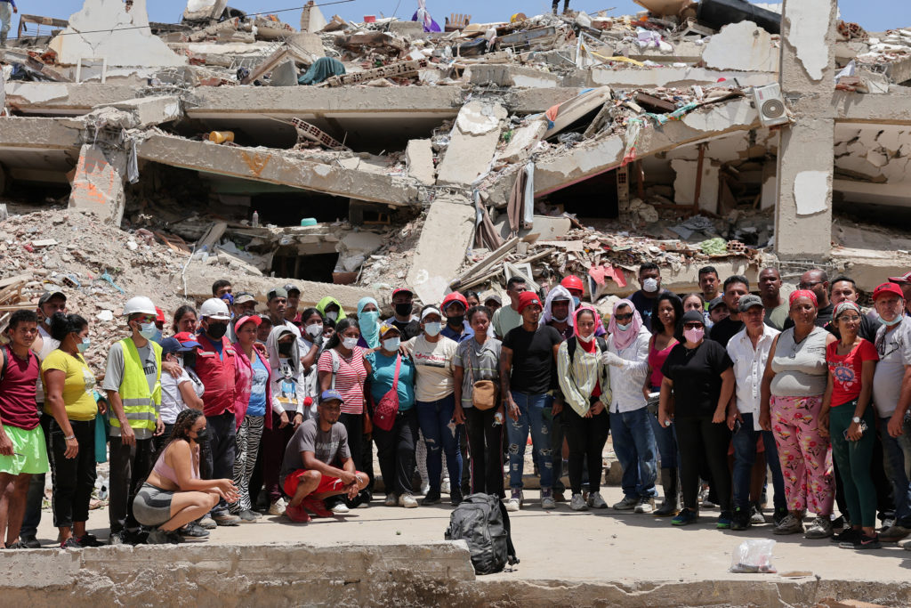 Source-feed image associated with Venezuela rescue efforts grow desperate as death toll rises and aftershock rattles country