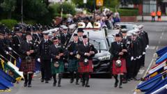 Source-feed image associated with Hundreds line the streets for funeral of PC killed in wrong way crash on A66