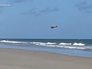 Source-feed image associated with WATCH: New video shows plane crashing off Florida beach