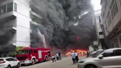 Source-feed image associated with Factory fire kills at least 28 in China's 'shoe capital'