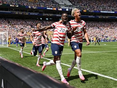 Source-feed image associated with US defeats Australia 2-0 in 2nd World Cup win, securing spot in knockout round