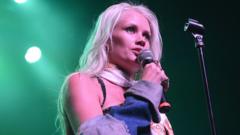 Source-feed image associated with Party Rock Anthem singer Lauren Bennett dies aged 36