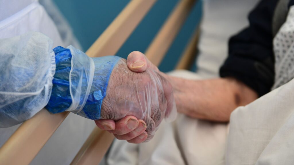 Source-feed image associated with Opinion: Medicine stopped shaking hands. We should start again