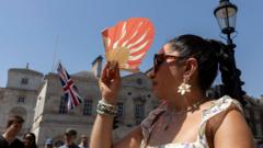 Source-feed image associated with UK braced for hottest June night after 36.7C high on warmest day of year