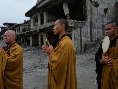 Source-feed image associated with Nepal holds a day of mourning after floods kill at least 1,300 people