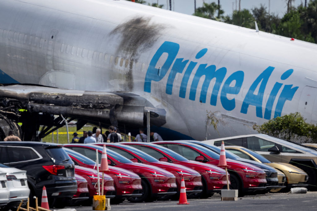 Source-feed image associated with All 5 killed in Miami airport cargo jet crash were in a van used by plane cleaners