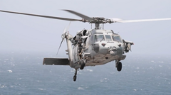 Source-feed image associated with US says helicopter fired missiles to disable ship breaking Iran blockade