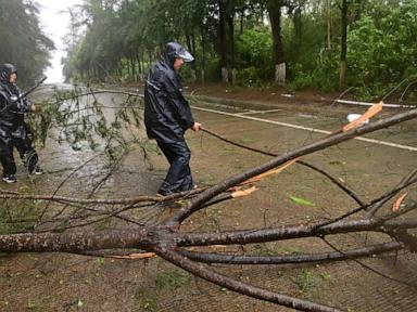 Source-feed image associated with Heavy rains leave 5 dead in China's north; tropical storm hits the south and Vietnam