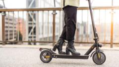 Source-feed image associated with Paris tells e-scooter riders to wear safety gear or face fines