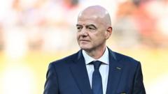 Source-feed image associated with Uefa says boycott may still go ahead as FA withdraws Infantino support