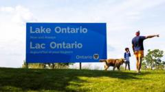 Source-feed image associated with Canada installs large Lake Ontario sign in latest jab at US