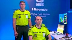 Source-feed image associated with VAR official says hand gesture was 'involuntary, subconscious twitch'