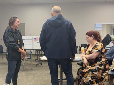 Source-feed image associated with Election worker says federal officers confronted her at polls over social media post criticizing ICE