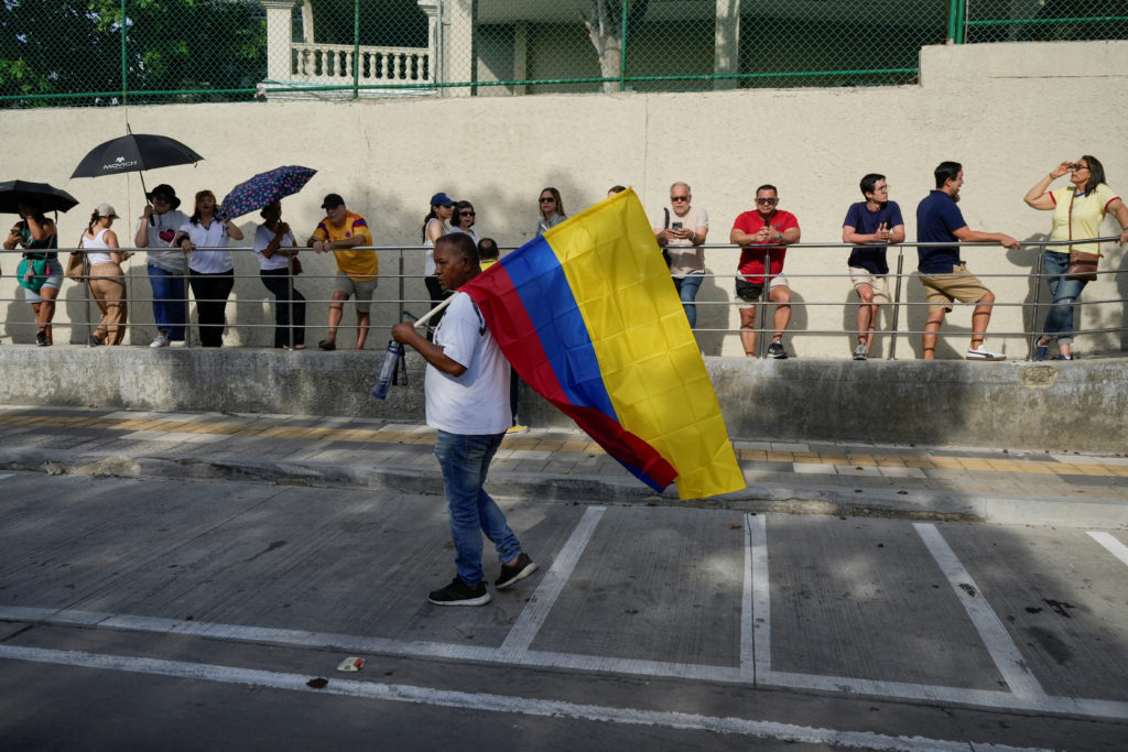 Source-feed image associated with Colombians vote in a presidential runoff that pits an outsider against a progressive