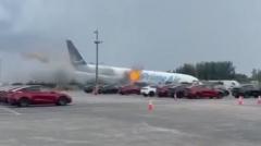 Source-feed image associated with Watch: Cargo plane overshoots runway at Miami airport