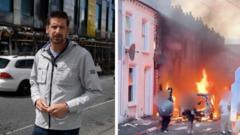 Source-feed image associated with Destruction shows torched homes and vehicles