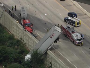 Source-feed image associated with WATCH: Dangling big rig shuts down major Texas highway for hours