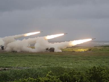 Source-feed image associated with Taiwan fires rockets in China's direction from a US-supplied mobile launching system in drill
