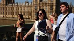 Source-feed image associated with Hottest June day on record for the UK as temperature reaches 36C