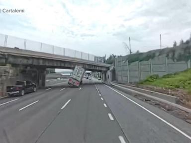 Source-feed image associated with WATCH: Video shows moment tractor trailer hits overpass