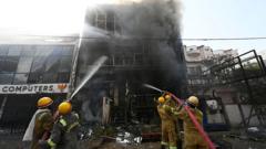 Source-feed image associated with Inquiry ordered after building fire kills 15 in north India city