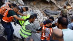 Source-feed image associated with Eight children among 21 killed after war-damaged Gaza building collapses, rescuers say