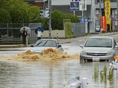 Source-feed image associated with Heavy rain and flooding in north-central Japan strands people and vehicles