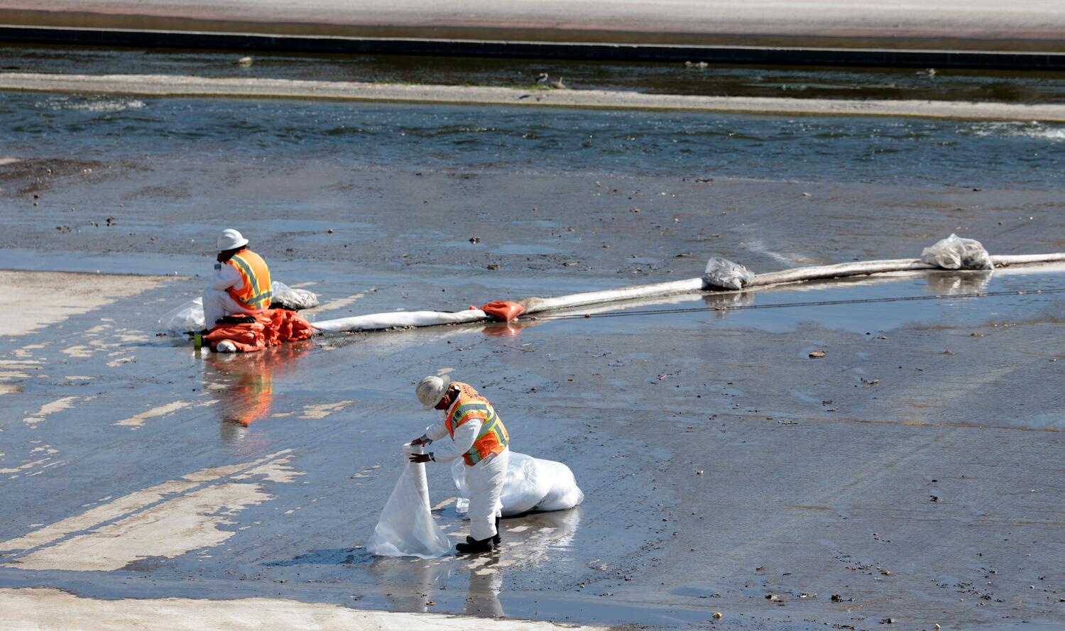 Source-feed image associated with Water from Boyle Heights warehouse fire carries foam into L.A. River, sparks testing