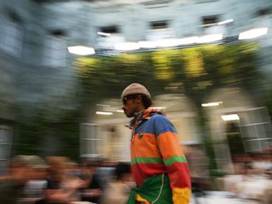 Source-feed image associated with Lewis Hamilton and Colman Domingo lead a star-studded front row at Ralph Lauren's Milan show