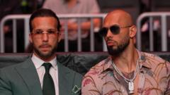 Source-feed image associated with Tate brothers arrested in US as further UK charges take total to 59