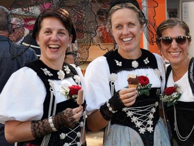 Source-feed image associated with Heat forces yodelers at annual Swiss festival to sing in fountains