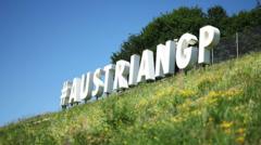 Source-feed image associated with Austrian GP declared heat-hazard race amid heatwave